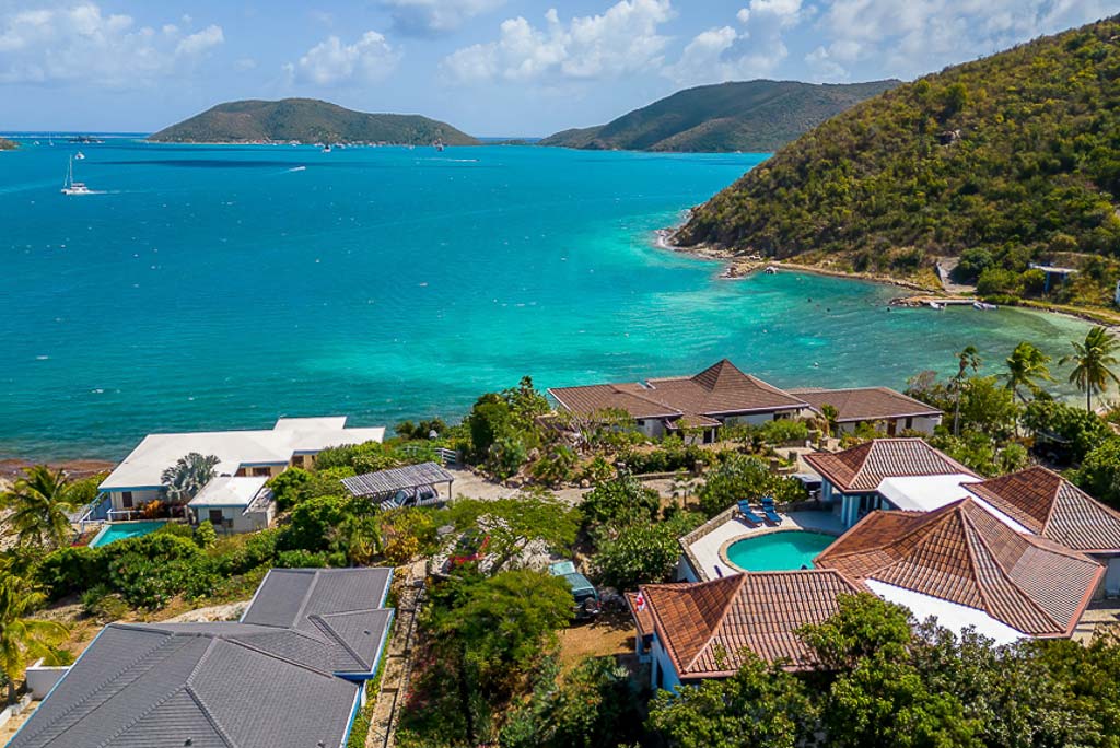 The blue waters and off-shore islands of Leverick Bay with Euphoria villa and surrounding residences in the foreground.