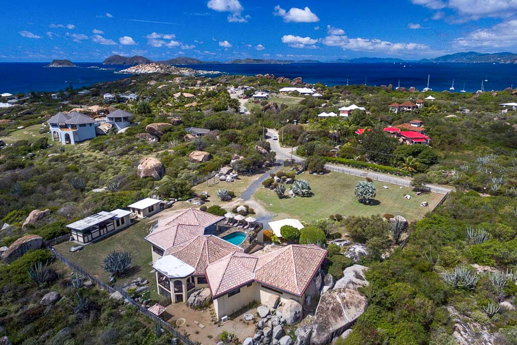 Mon Repos Villa on a large property at The Baths Virgin Gorda with The Baths National Park and sea in the background.